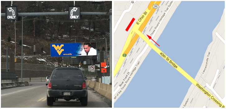 A badly placed dynamic billboard distracting drivers at a busy cross-section