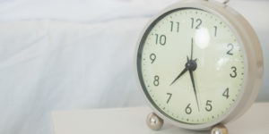 An analog alarm clock.