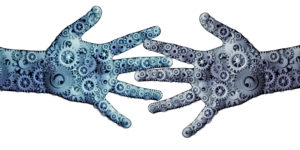 Gears superimposed over two human hands