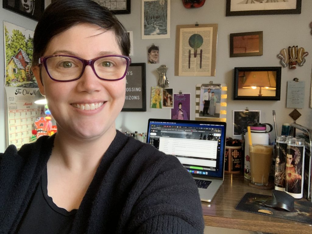 Daedalus UX Designer Jenn Scott taking a selfie at her desk at home