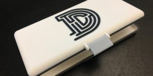 3D printed clamshell case with the Daedalus D logo