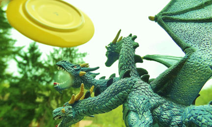 Dragon figurine with frisbee