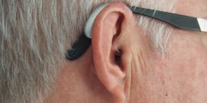 An close up view of an older man's ear.