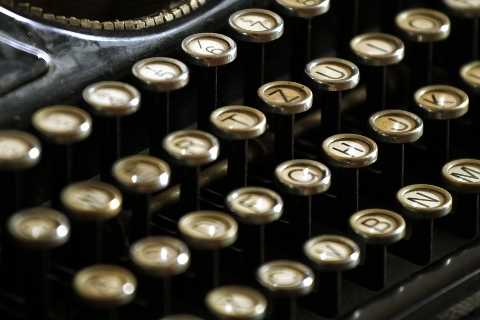 A close up of old fashioned typewriter keys