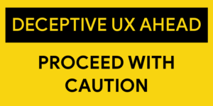 A sign that states Deceptive UX ahead proceed with caution